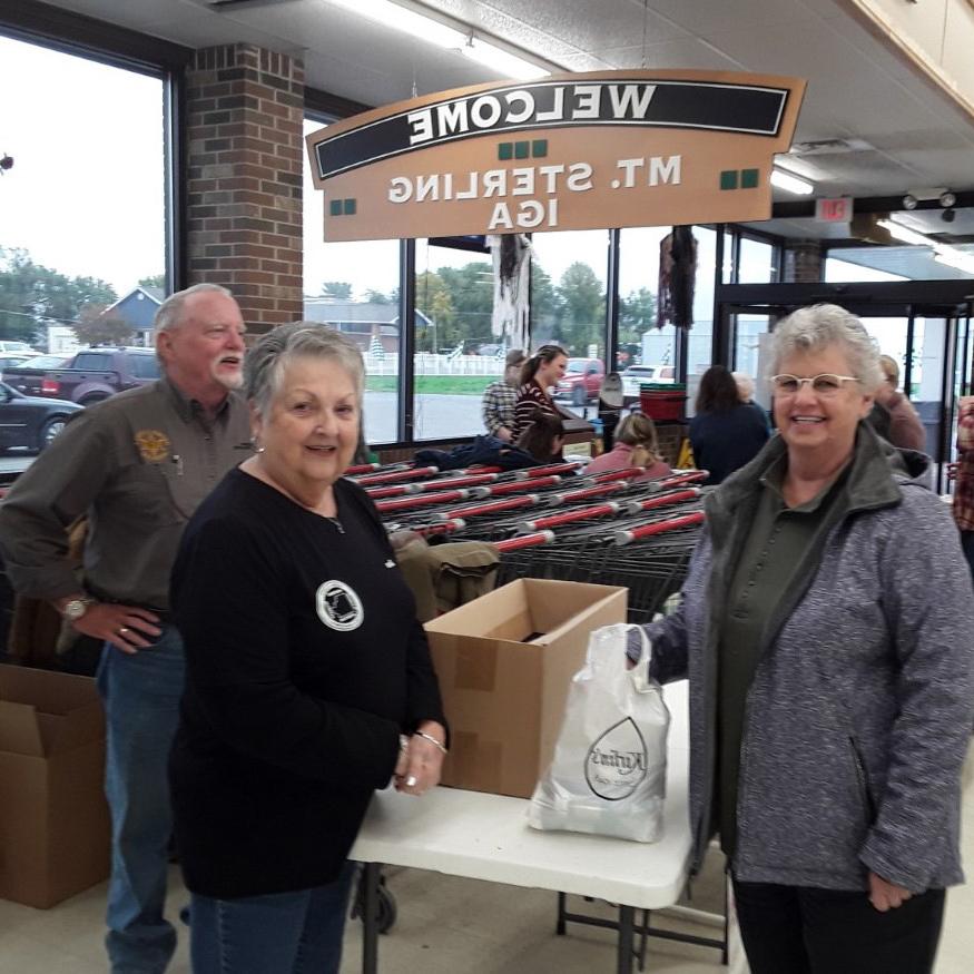 3 people posing at the Mt. Sterling IGA